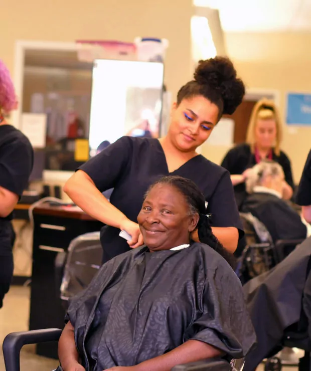 Cosmetology student practicing cutting hair. Credit: Central Carolina Community College (CCCC)