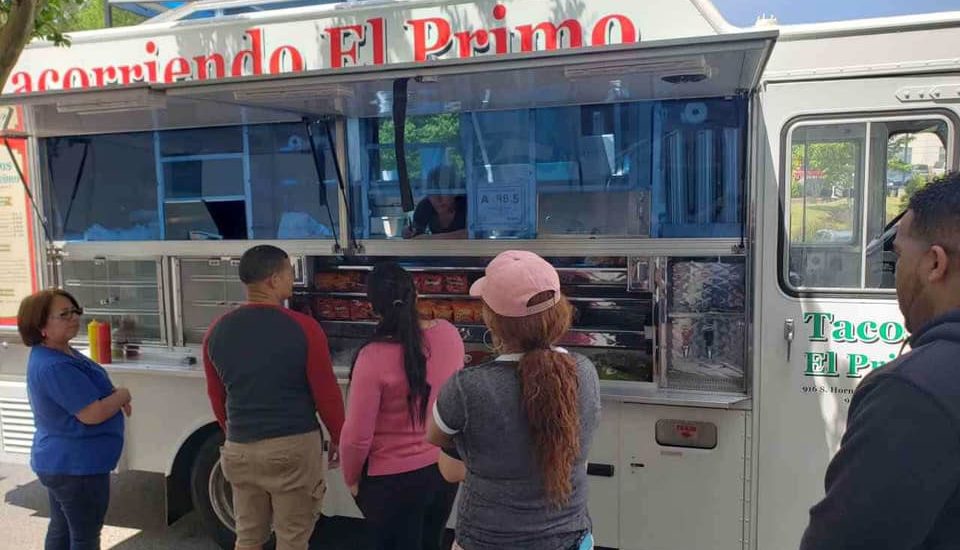 people getting food from a food truck