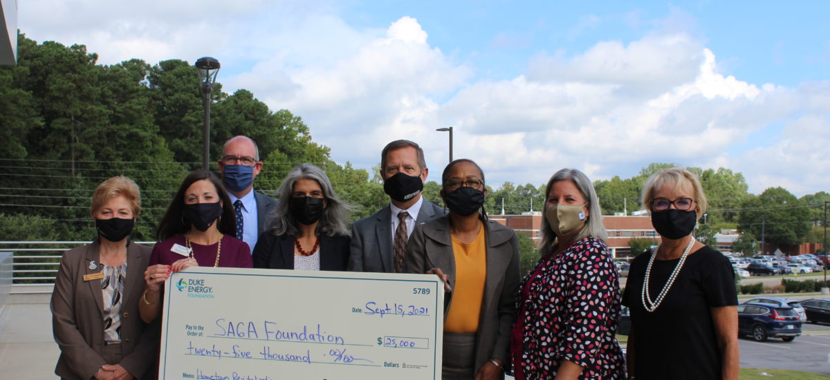 SAGA receiving a check from Duke Energy