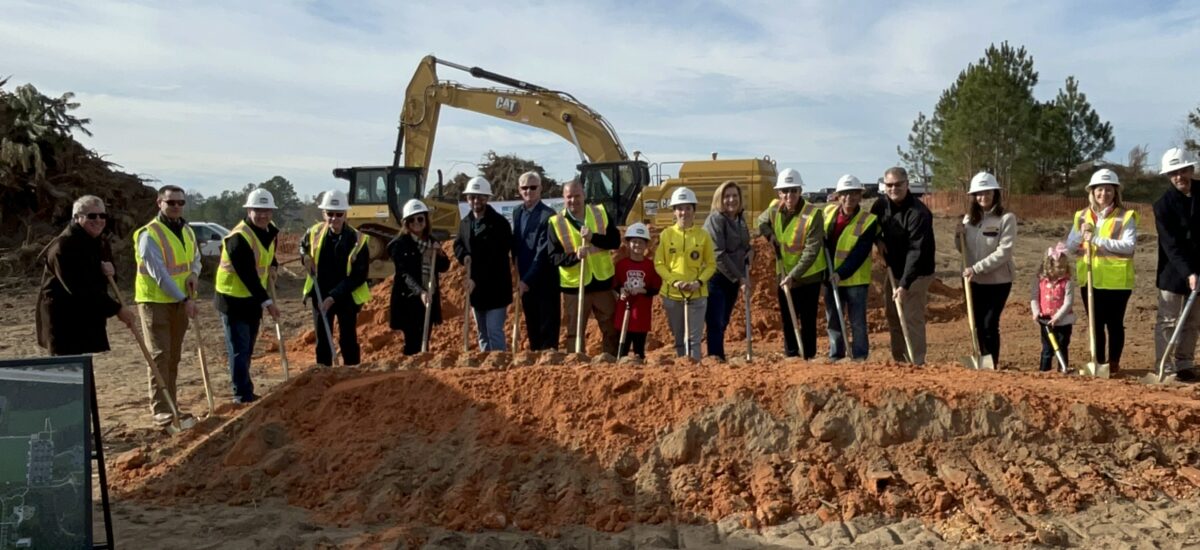 lee county athletic park groundbreaking. a group digging in the dirt with shovels