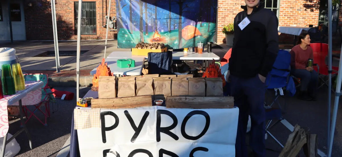 Young entrepreneur selling his items in downtown.