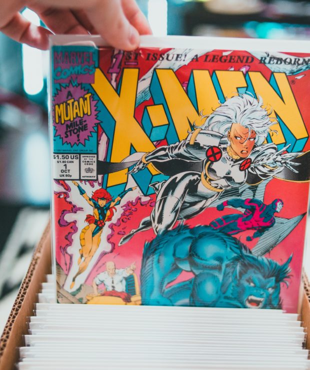 Person holds up vintage copy of X-men comic book. Credit: Pexels