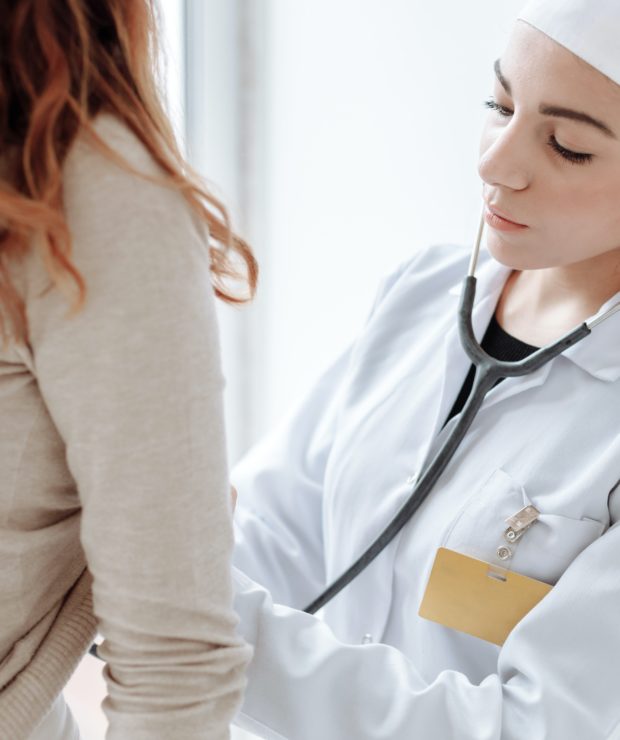 Doctor checking up on her patient with a stethoscope. Credit: Pexels